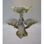 German porcelain figural centrepiece comport, the removeable pierced bowl decorated with sprays of