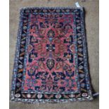 An antique Persian Lilihan rug, salmon ground, 86 x 60 cm