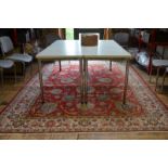 An antique Persian Tabriz carpet, the repeating floral design on red ground, 339 x 238 cm