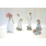 Four Lladro figures:  Cancion de Primavera, 7607, 1988, 19 cm high;  Lladro Privilege figure