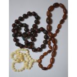 Three bead necklaces, one carved cinnabar style, one graduated and one white beads etc