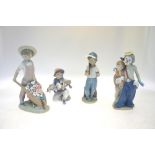 Four Lladro figures:  Carretilla con Flores, 1283, 24.5 cm high;  Littel Riders, 7623, Event