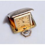 An Art Deco silver and gilt purse/travel watch, the 15-jewel Swiss movement with silvered square