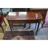 A mid 19th century gilt metal mounted mahogany folding card table, with baize lined interior over