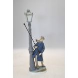 A Lladro model of a gas lamp lighter, 47 cm high Both thumbs missing