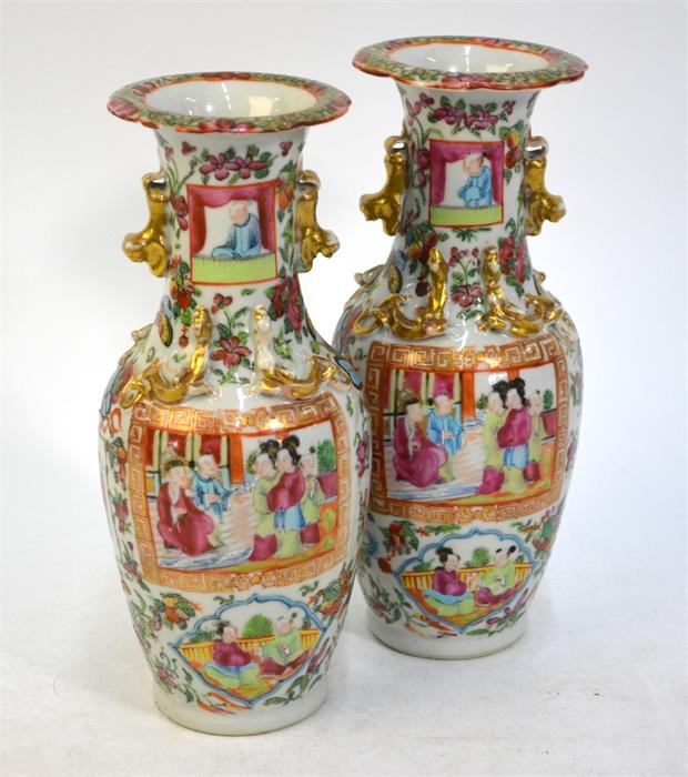 A pair of Canton famille rose vases; each one decorated with panels depicting Manchu/Chinese - Image 2 of 10