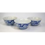 A set of three blue and white bowls; each one just under 13 cm diameter and decorated with a pair of