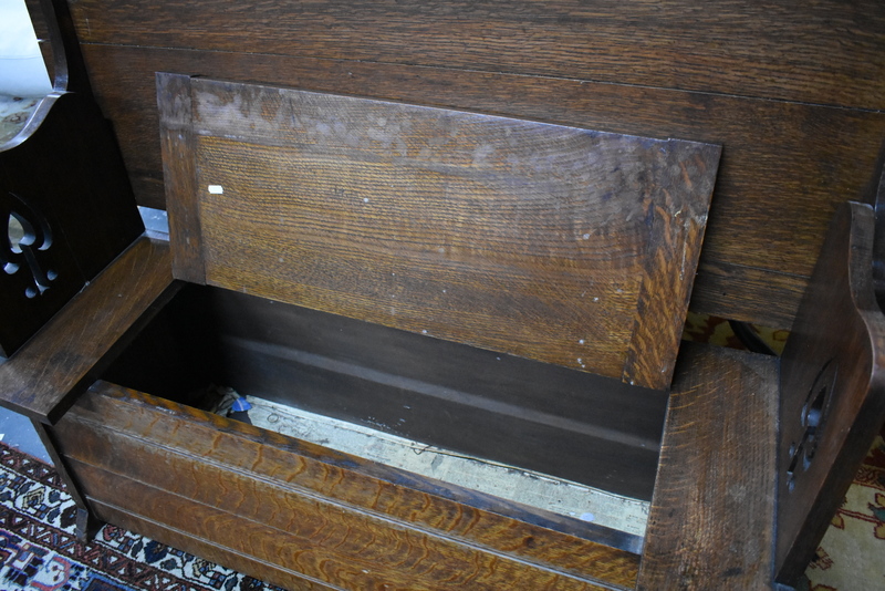 An Arts and Crafts period monks bench, the top hinging over to form a seatback, over a box seat with - Image 4 of 6