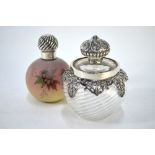 A Victorian globular opaque glass scent bottle with floral painted decoration and silver screw bun