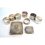 Seven various silver napkin rings, to/w an engraved cigarette case and similar vesta case,