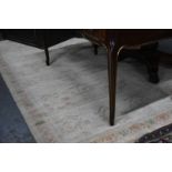 A handmade Indian Bharat Heini small carpet, the repeating design on ivory ground, 242 x 157 cm [