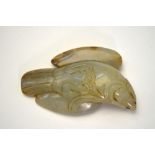 A Chinese mottled green jade, carved as a bird-of-prey, 6.5 cm long, post Qing Dynasty Extensive