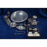 Various oddments of silver, including a three-piece condiment set with spoons, two tea strainers,