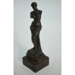 A brown-patinated bronze Venus de Milo, on composite base, 20 cm high overall