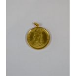 A Victorian full sovereign dated 1895, in yellow metal mount stamped 18k, approx 8.9g