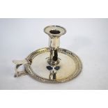 A George III silver chamberstick with beaded and foliate moulded rim, Makepeace & Carter, London