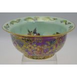 A Wedgwood fairyland lustre bowl designed by Daisy Makeig-Jones, the cherry red lustre exterior