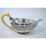 A fine and heavy quality Regency silver tea pot of compressed circular form, with reeded finial,