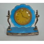 AMENDED ESTIMATE An Art Deco silver and basse-taille blue enamel boudoir clock with gilt and