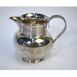 A late Victorian silver water jug with banded neck and reeded scroll handle, Zacheriah Barraclough &