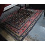 An antique Caucasian rug, the blue ground with stylised floral design, 170 x 130 cm even low pile,