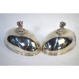 A pair of George III silver and oval domed dish-covers, engraved with Royal badge and two coronet