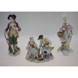 A 19th century porcelain figure of a gentleman in 18th century costume standing on a scrolling base,