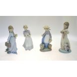 Four Lladro figures:  Flores a la Maestra, 7604, Collector's Society 1988, 21 cm high;  Happy