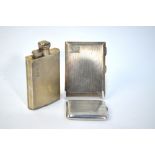 An Art Deco style silver 2ozs hip flask with hinged screw top and engine-turned decoration, James