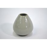 A modern, small grey monochrome vase on circular foot, about 6.5 cm high The body with a long