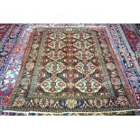 Persian Esfahan navy ground rug with 10 floral medallions within diamond guarded palmette border 190