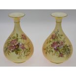 A pair of Royal Worcester blush ground floral decorated vases, date cypher 1912, shape 293, 19 cm