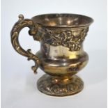 A William IV silver baluster Christening mug with scrolling handle and applied trailing oak