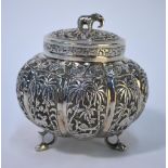 An Indian white metal melon-shaped sugar basin and cover with elephant finial, the lobed body richly