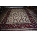 A handmade Turkish Lal carpet, the ivory ground with linked vine design, 321 x 242 cm [55075]