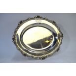 Paul Storr - A heavy silver oval platter with cast and chased shell and gadrooned rim, engraved coat