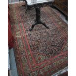 An antique Persian Hamdan kelleigh carpet, the Mina Khani design on navy ground, within green