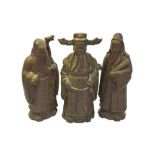 A set of three Chinese base metal figures designed as the Sanxing, each one approximately 24 cm