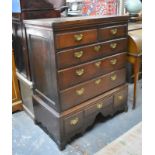 An 18th century oak chest on stand with two short, three long graduated drawers, the stand with