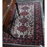 An antique Caucasian rug, 166 x 112 cm