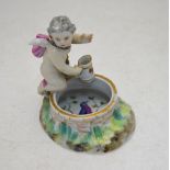 A 19th century Berlin porcelain figural posy vase modelled as a well with Cupid holding a water jug,
