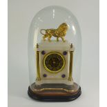 A late 19th century 8-day mantel clock, the white onyx case surmounted by a gilt spelter lion, the