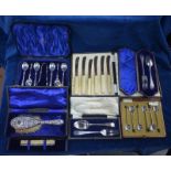 A cased set of six apostle tea spoons with tongs, Sheffield 1910, a cased set of six coffee spoons