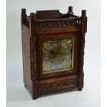 Desprez, Bristol, an Aesthetic period oak cased mantle clock with silvered dial flanked by gilt