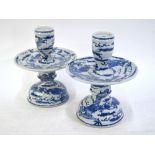 A pair of modern, blue and white, candle or joss-stick holders; each one with circular plate