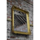 A gilt framed Victorian style bevel edge mirror, 93 x 76 cm