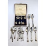 A matched part set of five George III and Victorian modified King's pattern dessert spoons, London