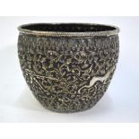 A white metal bowl (probably Indian) of tapering, cylindrical form decorated on the exterior with
