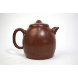 An elegant Yixing teapot and cylindrical, domed cover, decorated with a calligraphy inscription