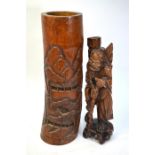 A tall Chinese bamboo brushpot, decorated with pine clad mountainous retreats, 45 cm high;